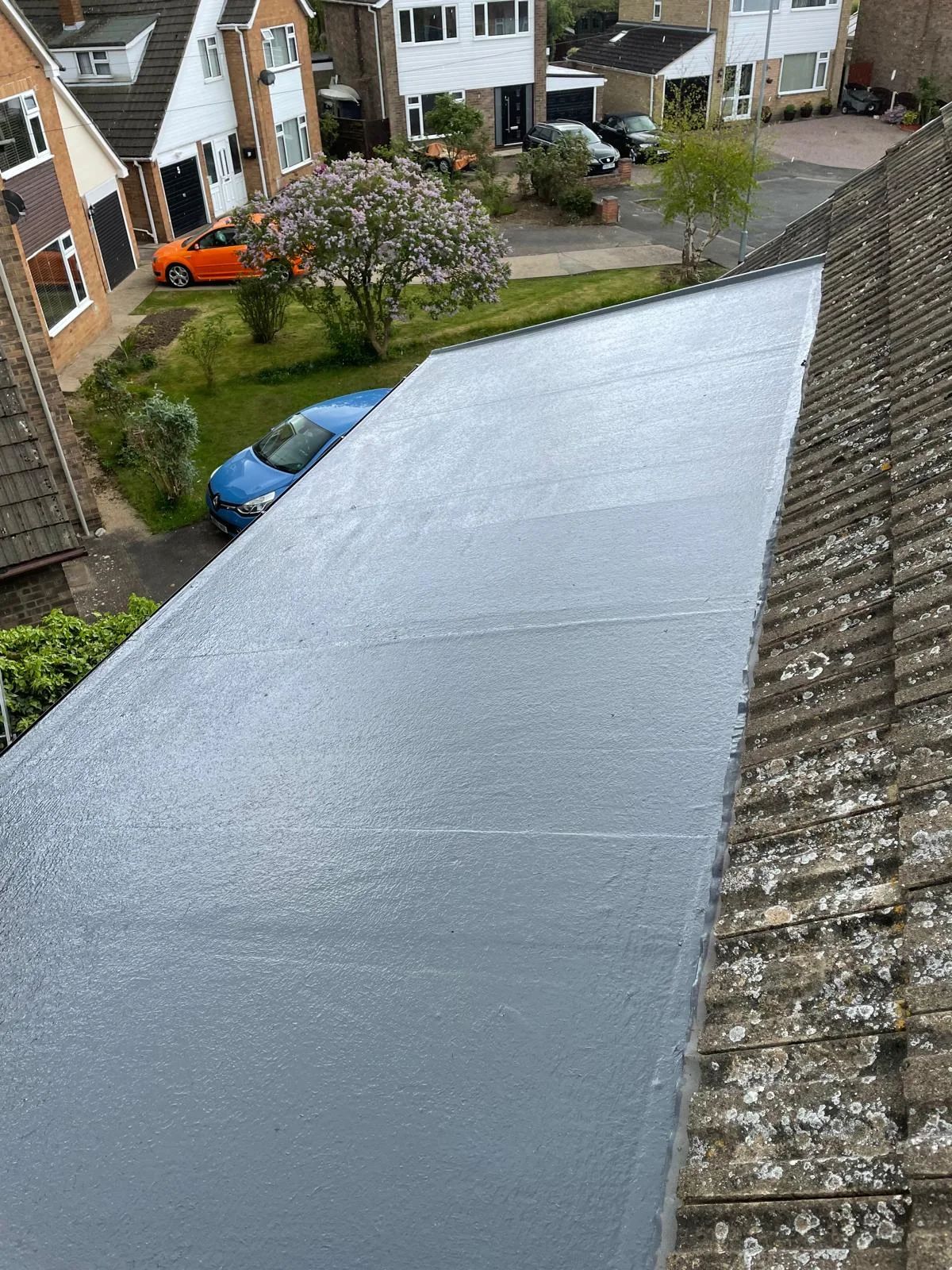 Long GRP flat roof running the length of a single-storey extension