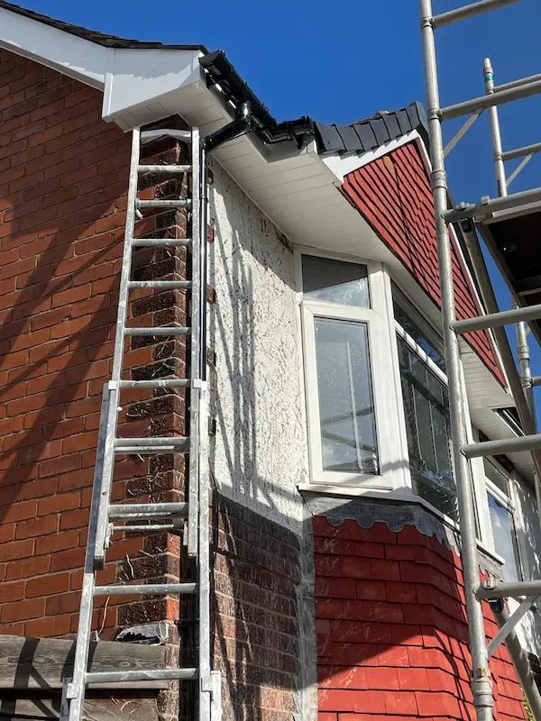 Ladder against a house during guttering and fascia work